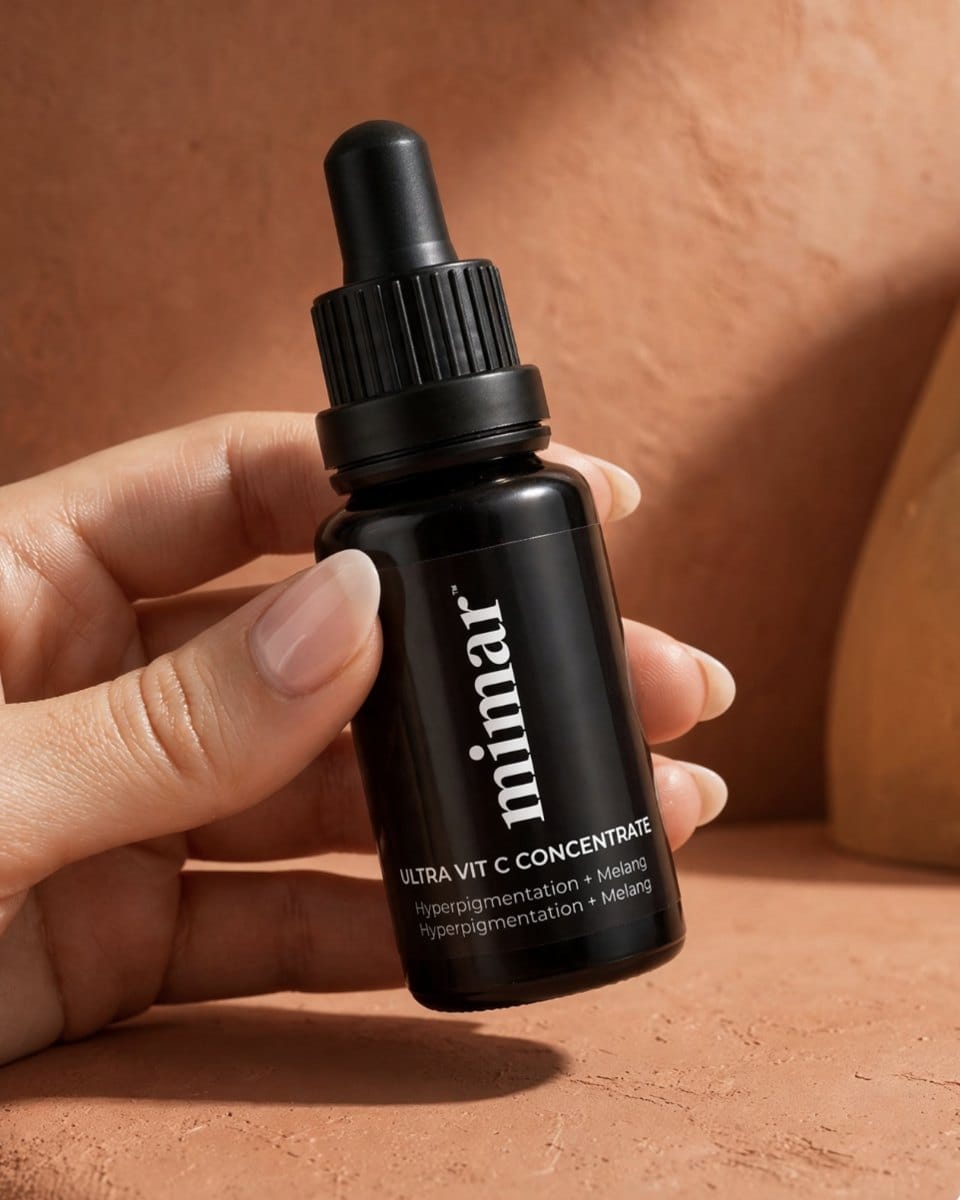 Hand holding a bottle of Mimar Ultra Vit C Concentrate